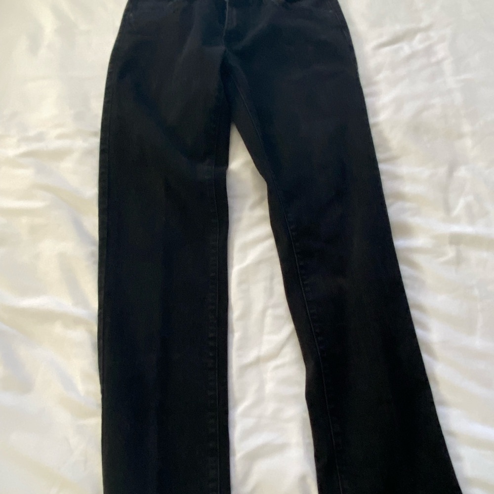 Black Slim Jeans with a sleek design and full-length fit
